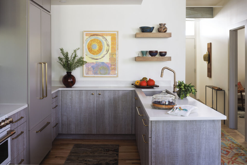 Golden Triangle Hi-Rise kitchen island with open shelving and brass fixtures — company kd