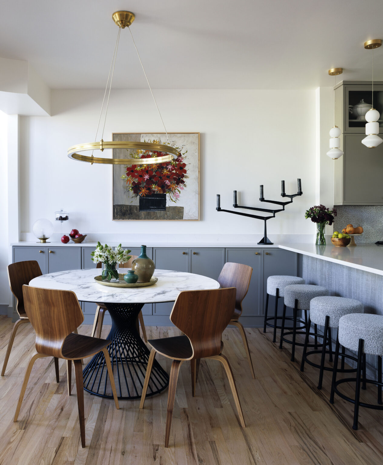 Golden Triangle Hi-Rise dining room with brass ring chandelier and walnut chairs — company kd